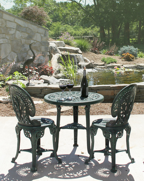 shared patio at base of waterfall and pond