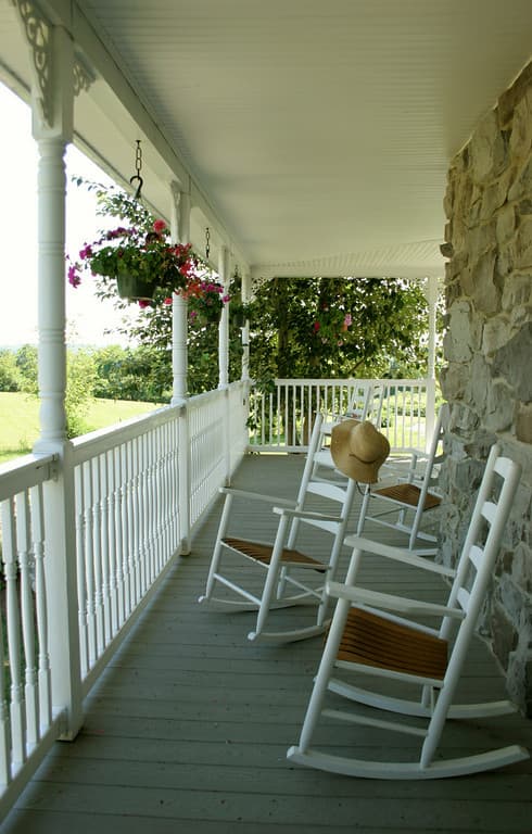 Private entrance to a shared patio with rockers