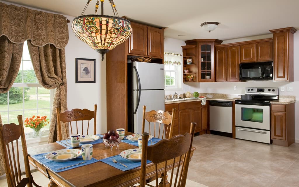 dining room table and chairs next to kitchen