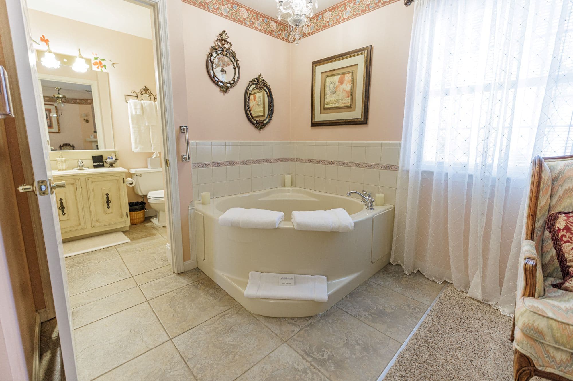 Corner jacuzzi tub in a romantic guest room designed for relaxation and couples