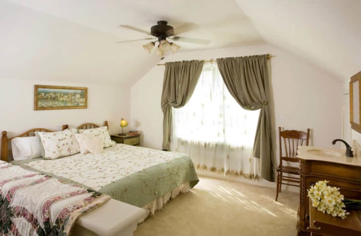 Loft area with king size bed, window and dresser