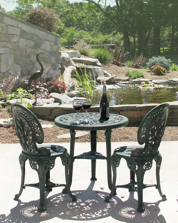 shared patio at base of waterfall and pond