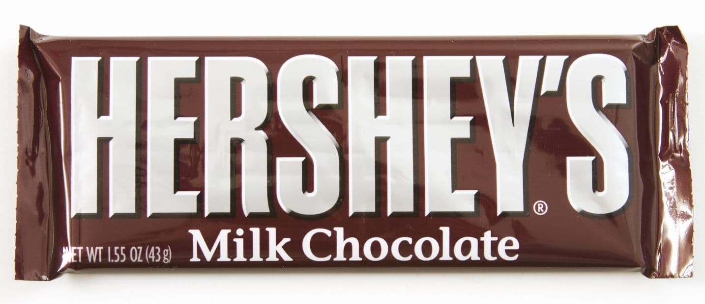 A Hershey's Milk Chocolate bar wrapped in brown packaging.