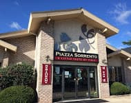 Exterior of Piazza Sorrento restaurant with brick facade and sign.