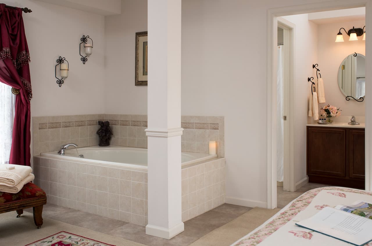 oval jacuzzi near bathroom