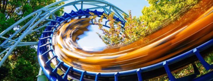 Spiral roller coaster coasting through the trees