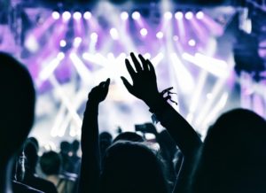 crowd with hands up at a concert